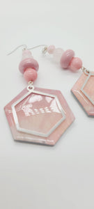 Length: 4 inches | Weight: 1.1 ounces  Distinctly You! These earrings are made with hexagon shapes and charms using polymer clay in pink and white, 10mm pink and frosted white glass beads, pink rondelles, and 6mm pink faceted glass stones.