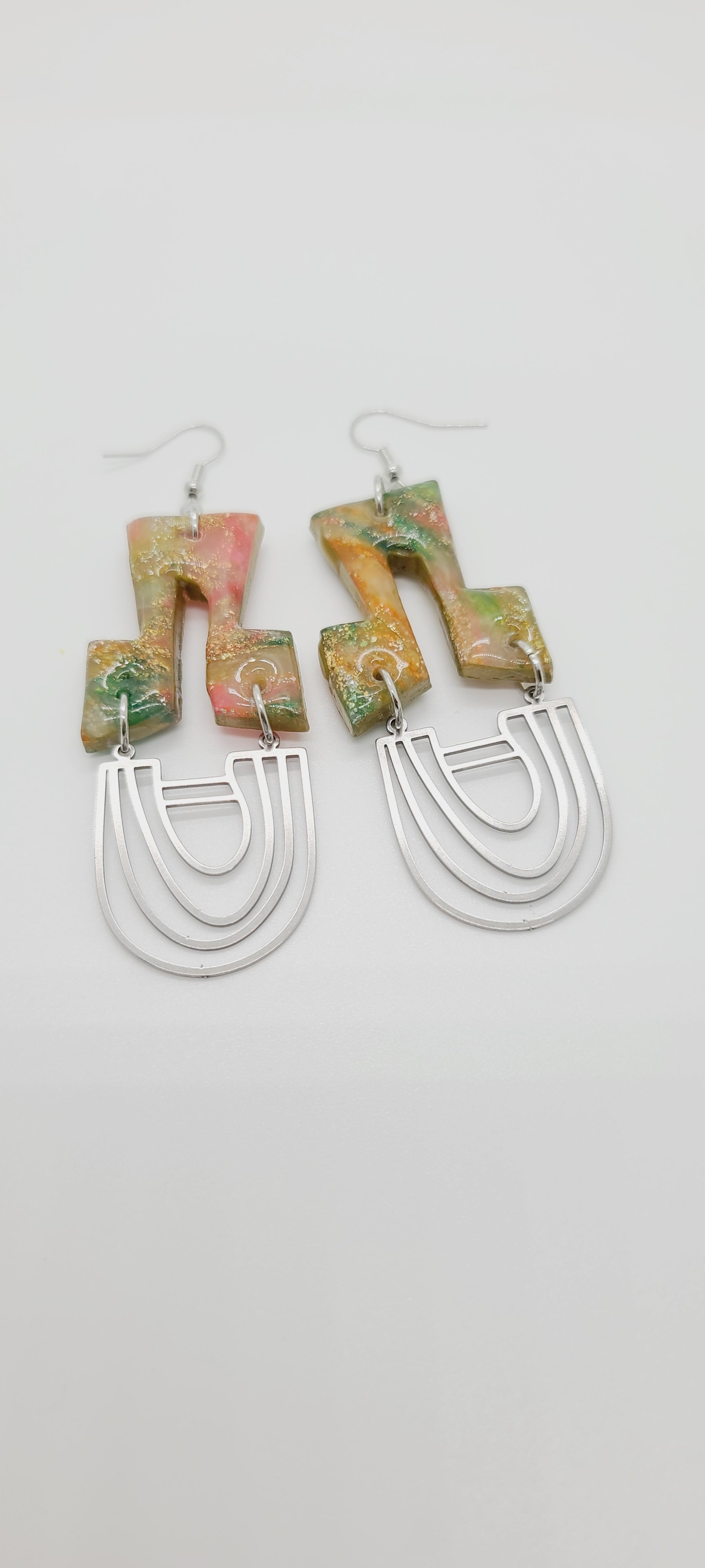 Length: 3.5 inches | Weight: 0.5 ounces  Distinctly You! These earrings are made with top hat shaped polymer clay in orange green gold with gold flakes, and silver U-shape charms.