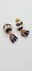Length: 3 inches | Weight: 0.8 ounces  Distinctly You! These earrings are made with ethnic print red and black wooden hand painted elephants from artisans in Copenhagen Denmark, white Batik bone discs, black and gold Ashanti glass rondelles, black and white large Batik bone beads, and silver spacers.