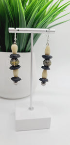 Length: 2.75 inches | Weight: 0.6 ounces  Distinctly You! These earrings are made with black Ashanti glass rondelles, Ivory ceramic stone beads, 10mm  black and white print ceramic beads, and 8mm silver beads.