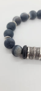 Length: 7.75 inches | Weight: 1.8 ounces  Distinctly You! This bracelet is made with 12mm dark grey spiral Agate beads, 14mm Ashanti glass rondelles, with accents of silver spacers and chrome charms.