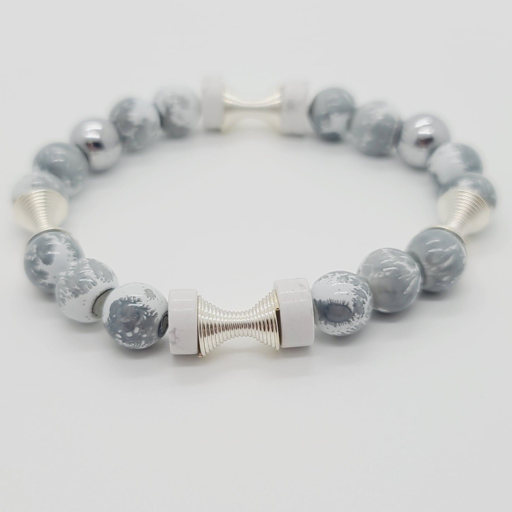 Length: 7.5 inches | Weight: 0.9 ounces  Distinctly You! This bracelet is made with 10mm grey and white glass beads,10mm chrome beads, silver spring charms, and ceramic spacers.