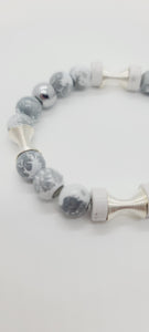 Length: 7.5 inches | Weight: 0.9 ounces  Distinctly You! This bracelet is made with 10mm grey and white glass beads,10mm chrome beads, silver spring charms, and ceramic spacers.