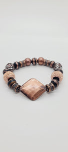 Length: 7.75 inches | Weight: 2.6 ounces  Distinctly You! This double stack bracelet is made with 10mm black and copper glass beads, 10mm copper metal beads,10mm Hematite beads, 12mm resin sparkle beads, copper diamond shaped centerpiece, 10mm copper and brass charms and spacers.