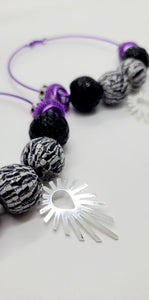 Length: 3.5x3.5 inches | Weight: 2.2 ounces  Distinctly You! These earrings are made with large purple hoops,15mm black and white striped beads, black and silver sequin beads, purple mesh rondelles, chrome hexagon rondelles, and silver sunburst charm.