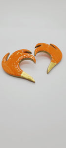 Length: 2.5 inches | Weight: 1.1 ounces  Distinctly You! These post earrings are made with orange and gold polymer clay in fire shape.