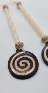 Length: 7 inches | Weight: 1.2 ounces  Distinctly You! These earrings are made with black and white Batik bone circular discs, Ivory hair bone slit tubes, black and white Batik bone rondelles, and gold spacers.