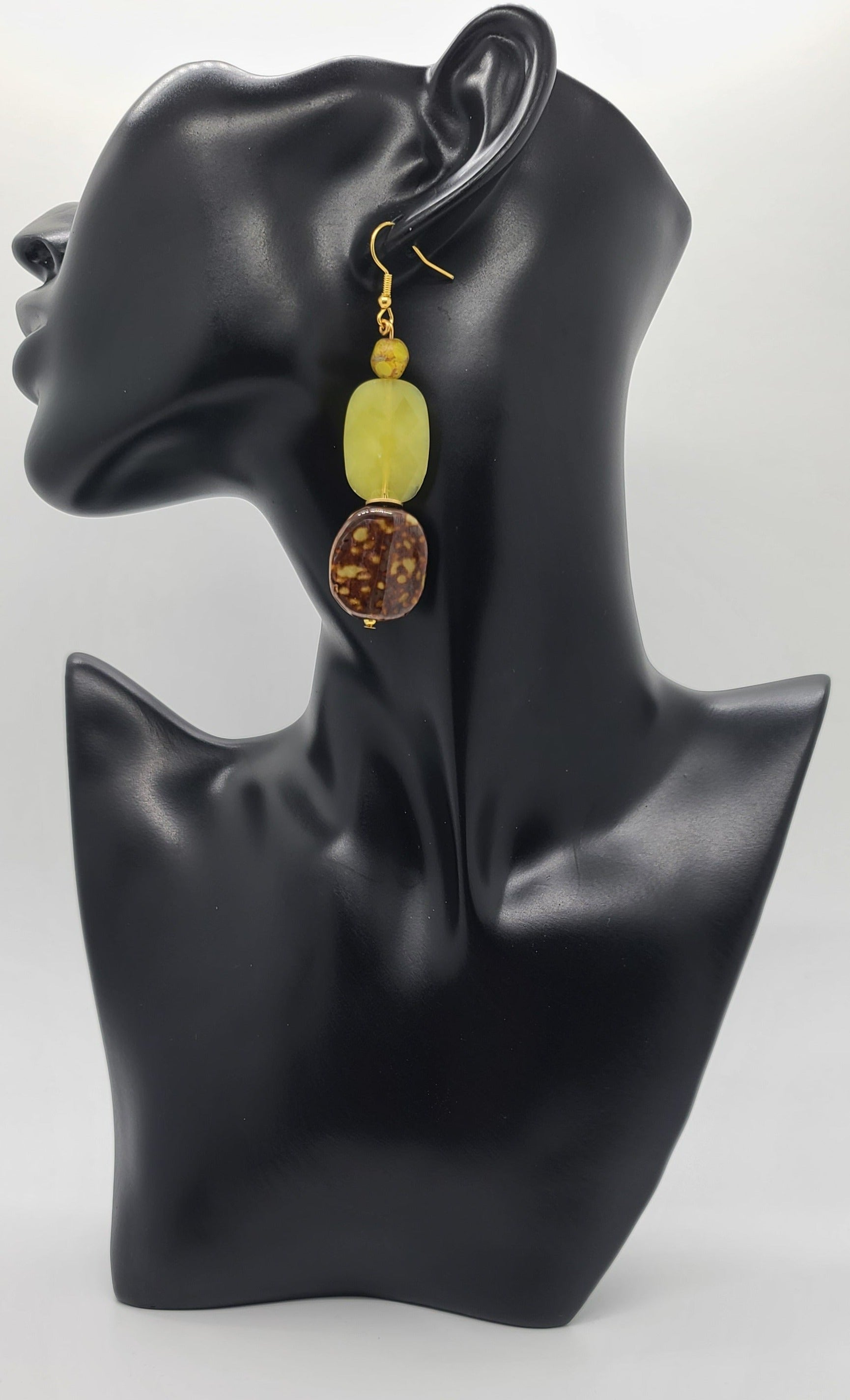 Length: 3 inches | Weight: 0.7 ounces  Distinctly You! These earrings are made with brown and gold print ceramic stones, citron green glass faceted stones, 8mm brown and green matte colored faceted glass beads, gold seed beads, and gold rondells.