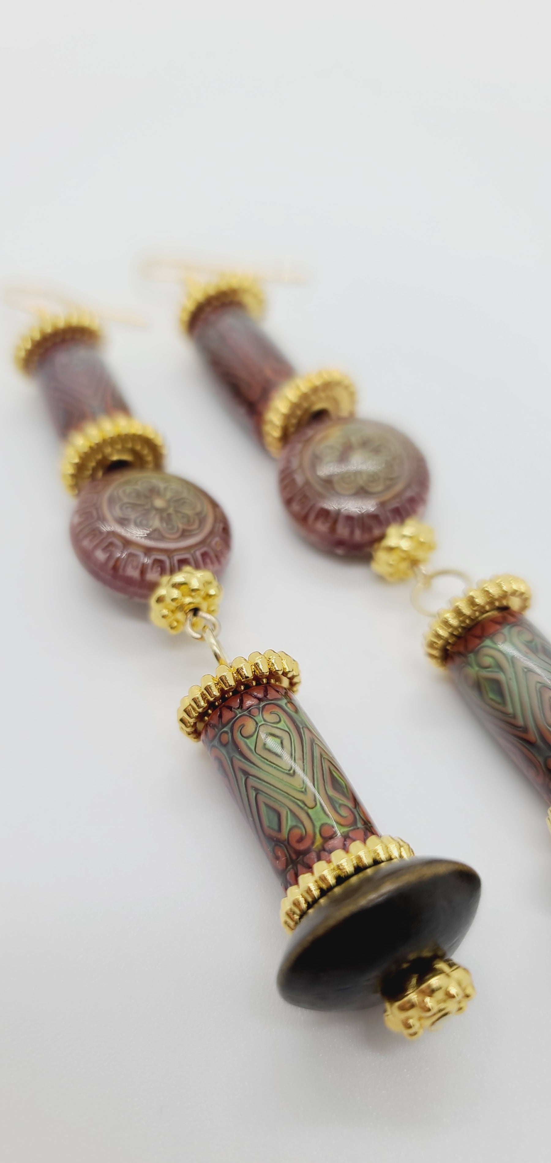 Length: 4 inches | Weight: 0.7 ounces  Distinctly You! These earrings are made with patterned printed wooden covered with resin beads, wooden Bicone beads, gold rondelles, and gold spacers.