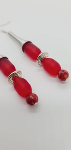 Length: 3.5 inches | Weight: 0.6 ounces  Distinctly You! These earrings are made with silver spring charms, silver rondelles, 12mm and 10mm oblong frosted red glass beads, and 6mm red marble glass beads.