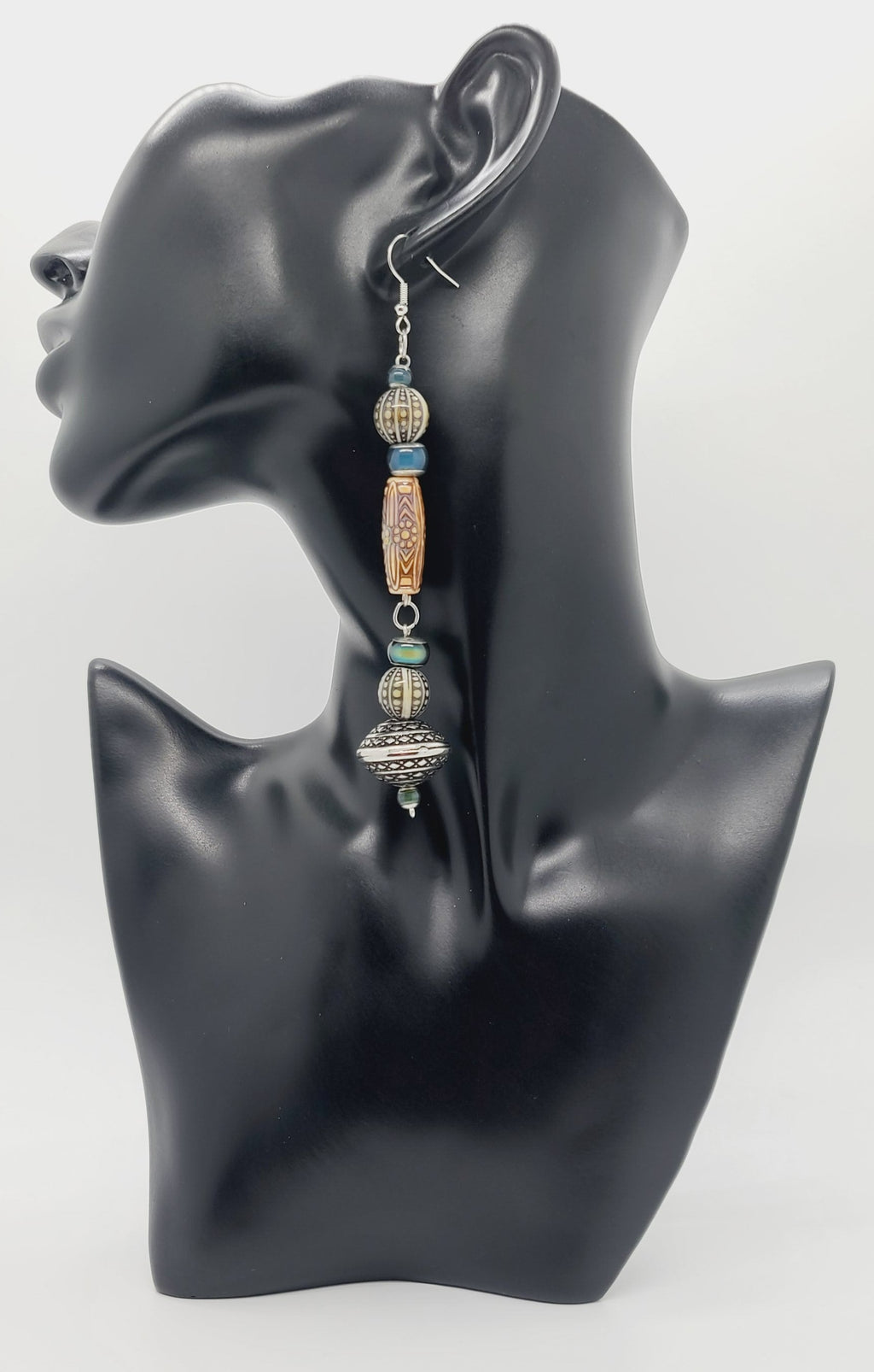 Length: 5 inches | Weight: 0.8 ounces  Distinctly You! These earrings are made with engraved silver Bicone charms, amber printed wood resin covered beads, 10mm grey and ivory printed resin beads, 3mm and 6mm green resin beads.