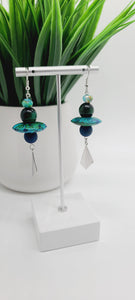 Length: 3 inches | Weight: 0.6 ounces  Distinctly You! These earrings are made with multi-colored blue polymer clay saucers, 10mm blue Druzy stones, 12mm green Tiger Eye stones, 6mm green faceted glass stones, and silver diamond-shape charm.
