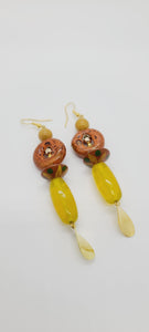 Length: 3.5 inches | Weight: 0.7 ounces  Distinctly You! These earrings are made with oblong citron glass beads, green and yellow wooden Bicone beads, orange bronze ceramic rondelles, 6mm gold ceramic stones, gold seed beads, gold hexagon, and gold charm.