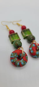 Length: 3 inches | Weight: 0.7 ounces  Distinctly You! These earrings are made with red and green Ashanti glass saucers, 12mm green ceramic stones, green and gold trim glass square box beads, 8mm red glass beads.