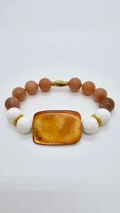 Amber stone with white lotus beads. (1267 Bracelet)