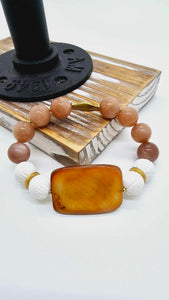 Amber stone with white lotus beads. (1267 Bracelet)