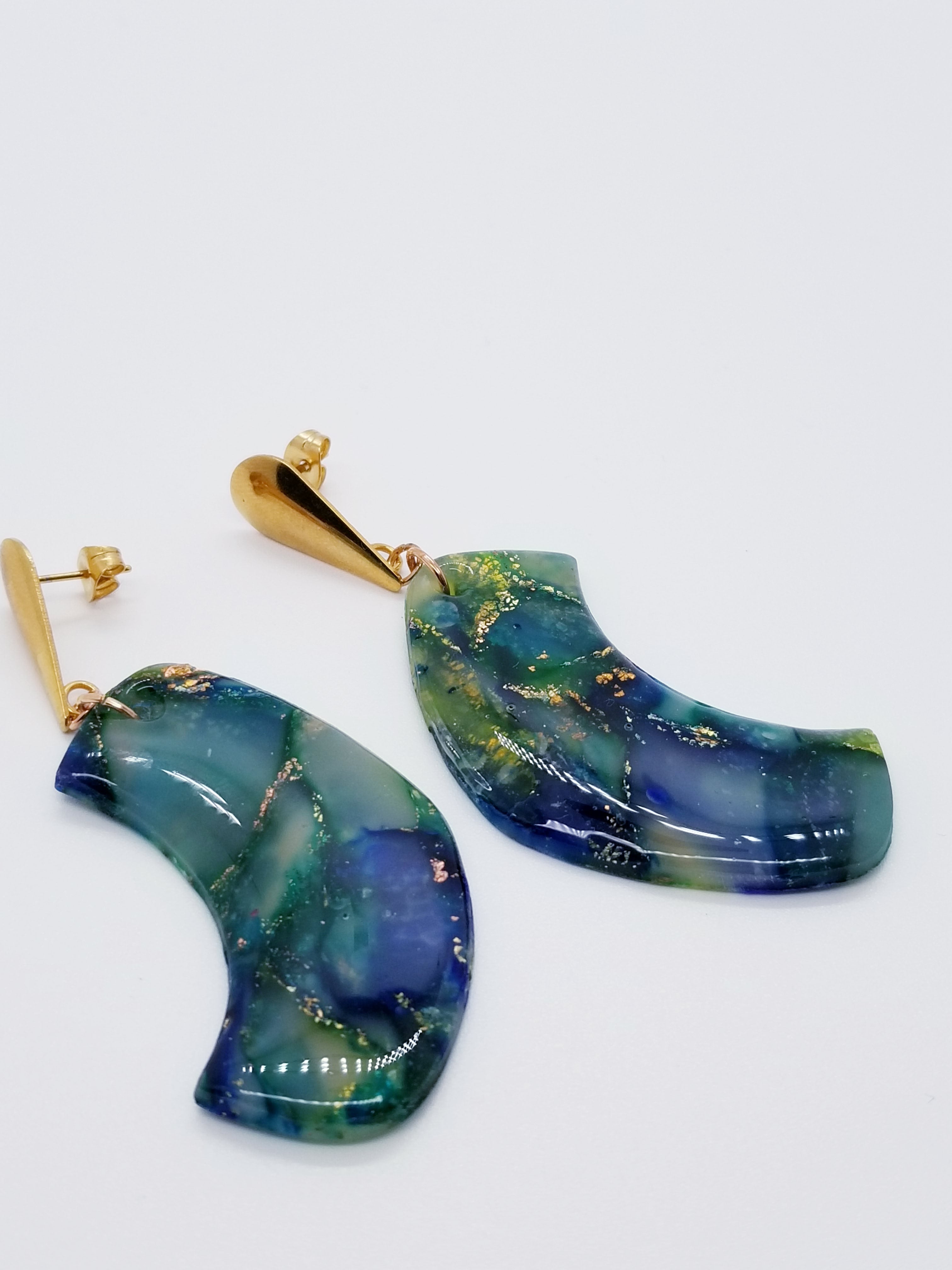 Length: 3 inches | Weight: 0.6 ounces  Designed just for you! The earrings are handmade using green blue swirl gold resin design, gold charm with hypoallergenic posts with back closures.