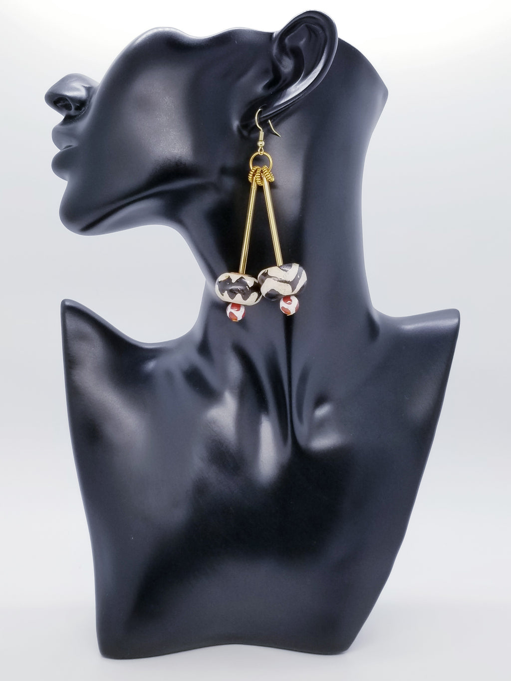 Length: 3.25 inches | Weight: 1.2 ounces  Designed just for you! The earrings are handmade using black and white barrel cylinder Batik Bone, black and white barrel Zebra Batik Bone, 6mm white and brown glass beads, gold ridged edge rondels, gold glass tubes, and hypoallergenic hooks with back closures. 