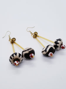 Length: 3.25 inches | Weight: 1.2 ounces  Designed just for you! The earrings are handmade using black and white barrel cylinder Batik Bone, black and white barrel Zebra Batik Bone, 6mm white and brown glass beads, gold ridged edge rondels, gold glass tubes, and hypoallergenic hooks with back closures. 