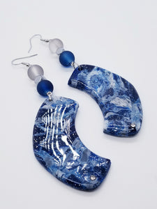 Length: 4 inches | Weight: 0.8 ounces  Designed just for you! The earrings are handmade using blue silver swirl resin design, 10mm blue frosted glass beads, 10mm grey frosted glass beads, 6mm silver hexagon beads, and hypoallergenic hooks with back closures. 