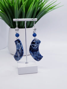 Length: 4 inches | Weight: 0.8 ounces  Designed just for you! The earrings are handmade using blue silver swirl resin design, 10mm blue frosted glass beads, 10mm grey frosted glass beads, 6mm silver hexagon beads, and hypoallergenic hooks with back closures. 