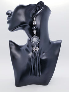 PLEASE BE AWARE: Earrings Hang Past Shoulders  5.5 inches or more  Length: 8 inches | Weight: 2.1 ounces (earlobe supports provided due to weight)  Designed just for you! The earrings are handmade using black faux bejeweled tassel, 14mm black faceted glass beads, 4mm black rhinestone rondels, 8mm silver faceted glass beads, and hypoallergenic hooks with back closures. 
