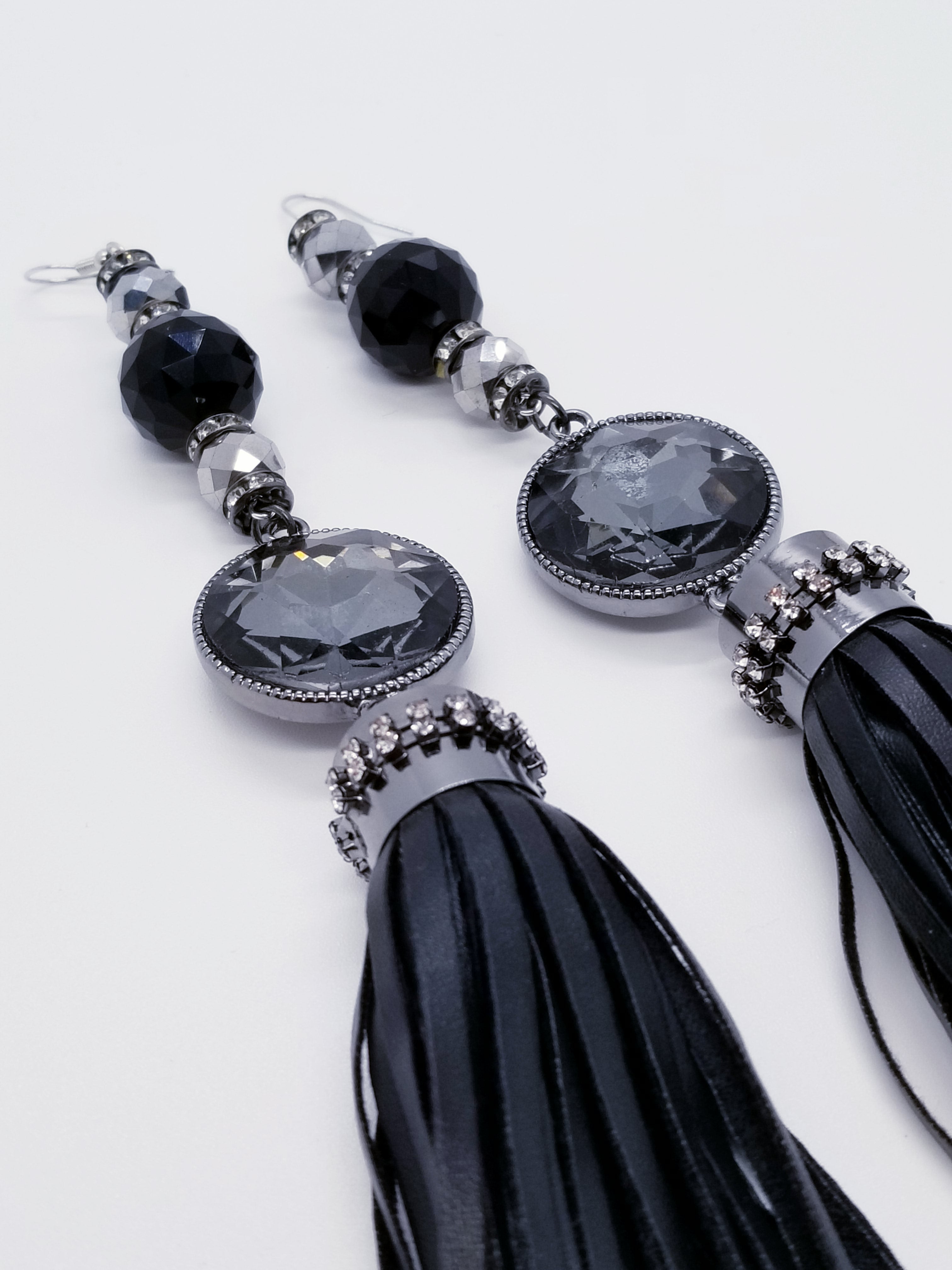 PLEASE BE AWARE: Earrings Hang Past Shoulders  5.5 inches or more  Length: 8 inches | Weight: 2.1 ounces (earlobe supports provided due to weight)  Designed just for you! The earrings are handmade using black faux bejeweled tassel, 14mm black faceted glass beads, 4mm black rhinestone rondels, 8mm silver faceted glass beads, and hypoallergenic hooks with back closures. 