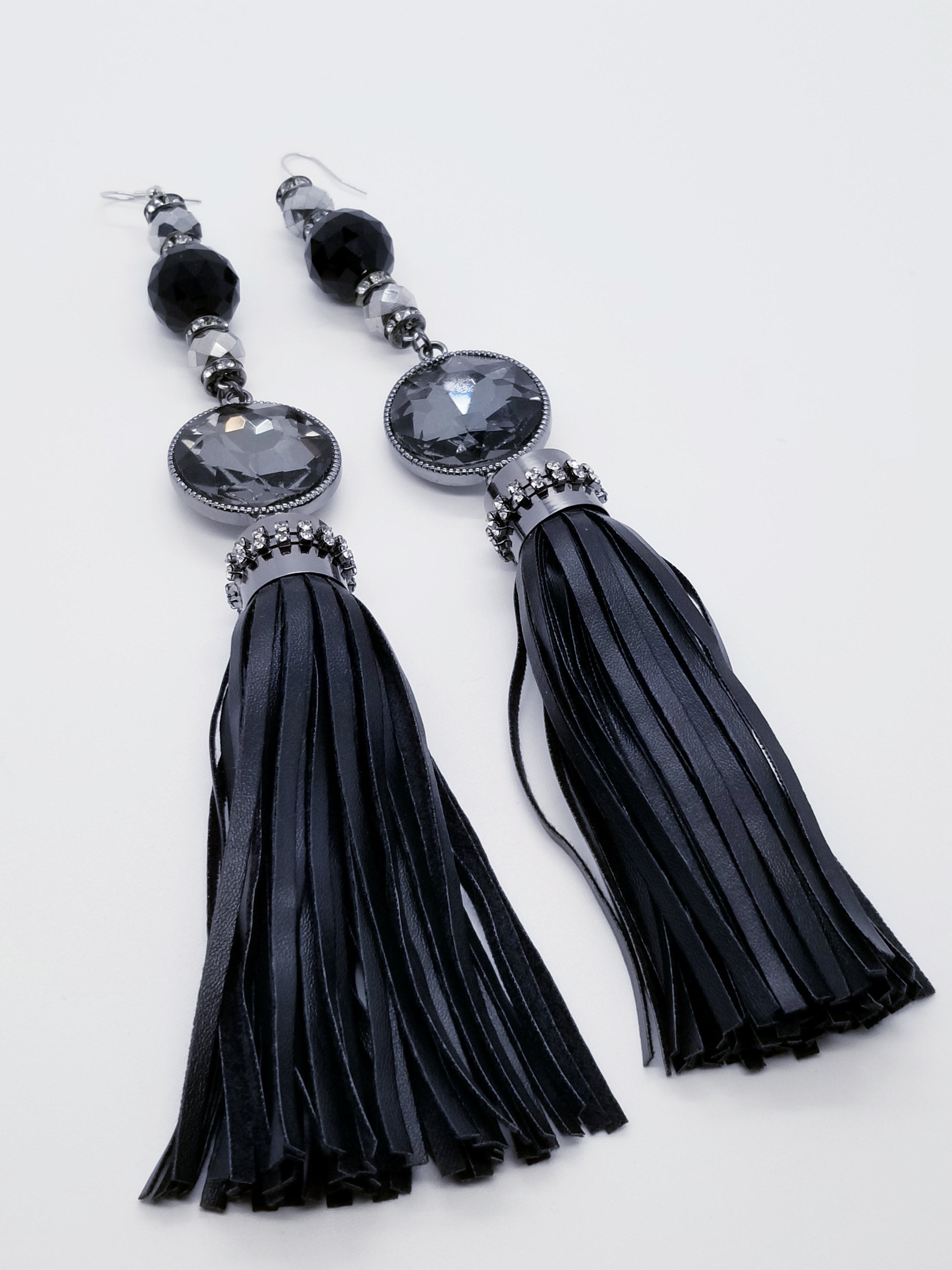 PLEASE BE AWARE: Earrings Hang Past Shoulders  5.5 inches or more  Length: 8 inches | Weight: 2.1 ounces (earlobe supports provided due to weight)  Designed just for you! The earrings are handmade using black faux bejeweled tassel, 14mm black faceted glass beads, 4mm black rhinestone rondels, 8mm silver faceted glass beads, and hypoallergenic hooks with back closures. 