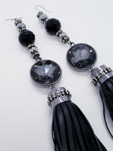 PLEASE BE AWARE: Earrings Hang Past Shoulders  5.5 inches or more  Length: 8 inches | Weight: 2.1 ounces (earlobe supports provided due to weight)  Designed just for you! The earrings are handmade using black faux bejeweled tassel, 14mm black faceted glass beads, 4mm black rhinestone rondels, 8mm silver faceted glass beads, and hypoallergenic hooks with back closures. 