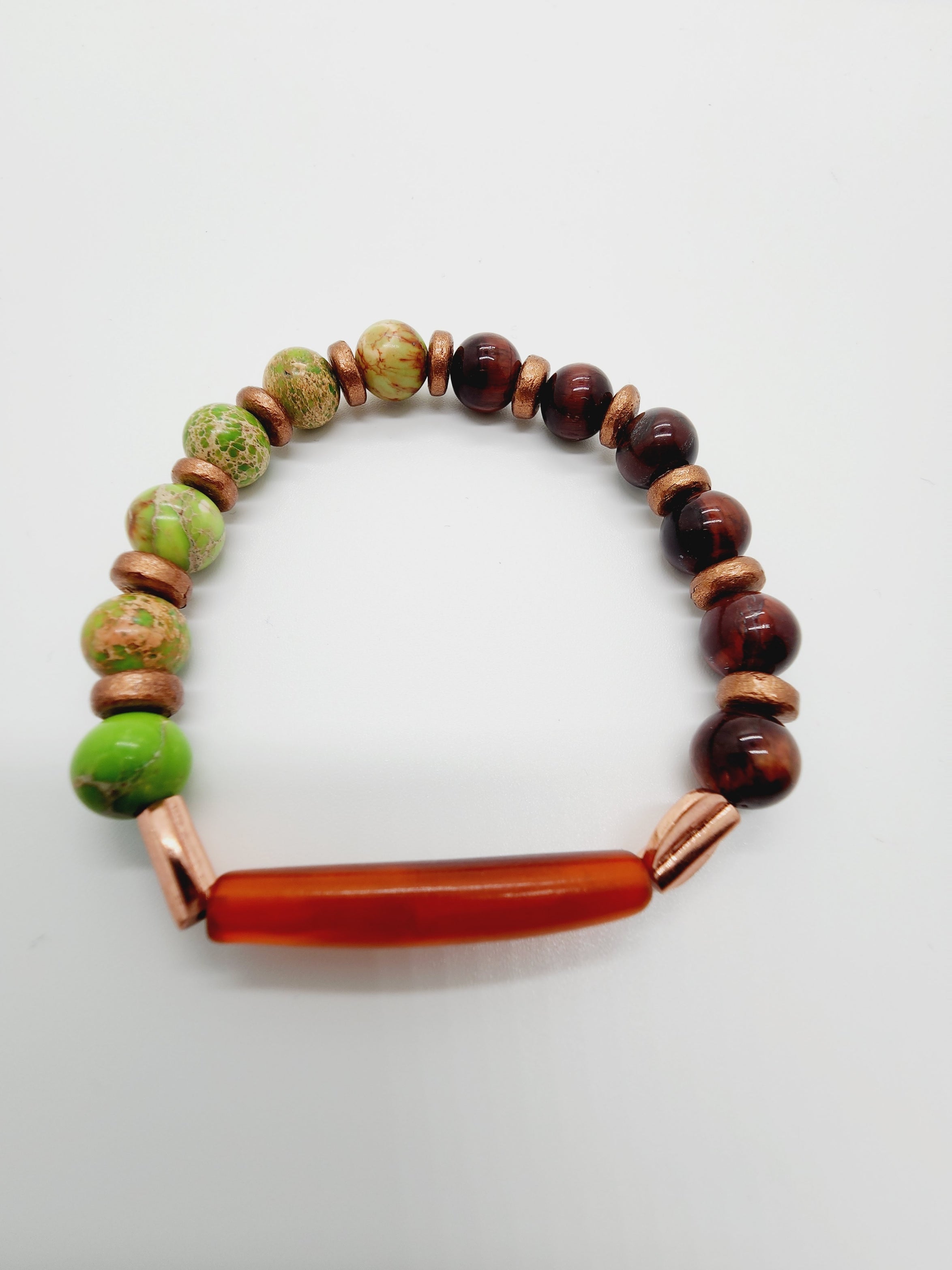 Length: 7.75 inches | Weight: 0.8 ounces  Distinctly You! This bracelet is handmade using Amber pipe bead and tiger eye beads, and bracelet uses 8mm latex free clear stretch cord. 