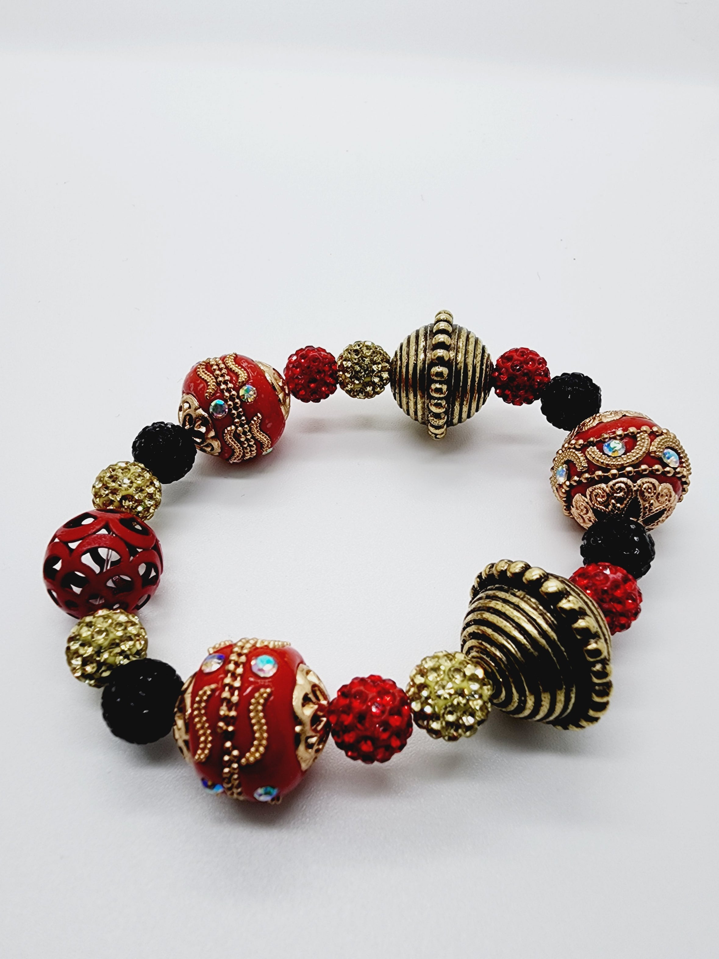 Length: 7.75 inches | Weight: 3.2 ounces  Distinctly You! This bracelet set is handmade using red, black, and gold ornate bead mix, and bracelet uses 8mm latex free clear stretch cord. 