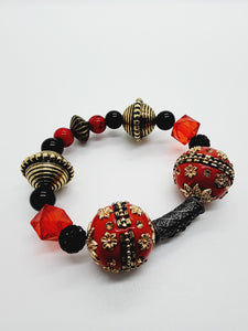 Length: 7.75 inches | Weight: 3.2 ounces  Distinctly You! This bracelet set is handmade using red, black, and gold ornate bead mix, and bracelet uses 8mm latex free clear stretch cord. 