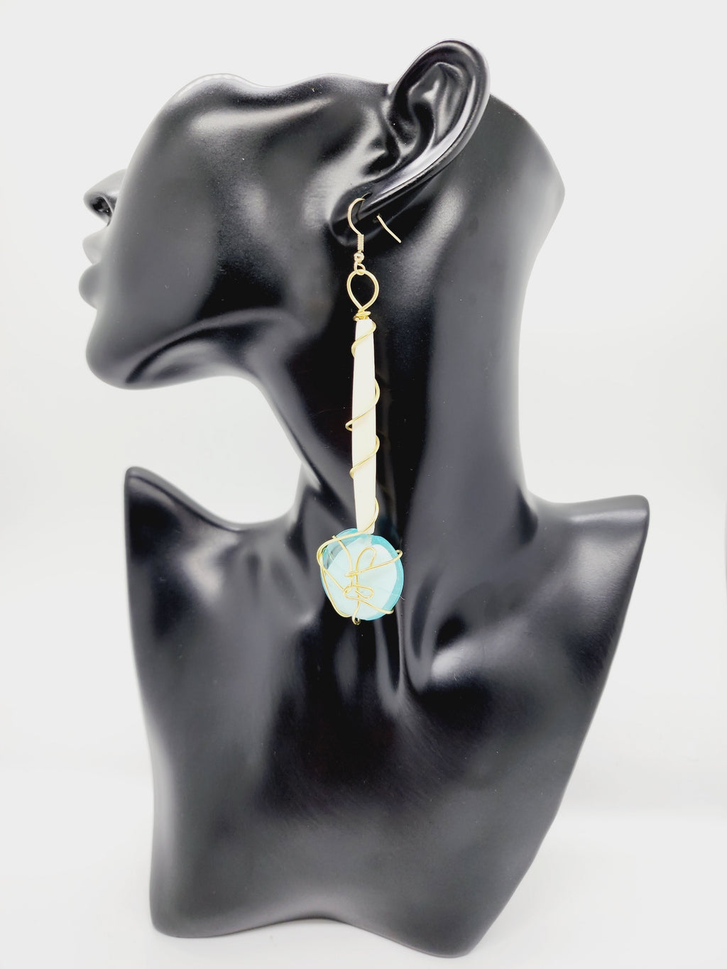 Length: 4.75 inches | Weight: 1.3 ounces  Distinctly You! These handmade earrings are made using white Batik bone tube, gold wire wrapping, Italian Murano aqua glass, and hypoallergenic hooks with back closures. 
