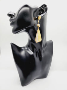 Length: 3 inches | Weight: 0.8 ounces   Distinctly You! These handmade earrings are made using white and gold polymer clay, brass hammered charm, 14kt plated gold stud posts with back closures. 