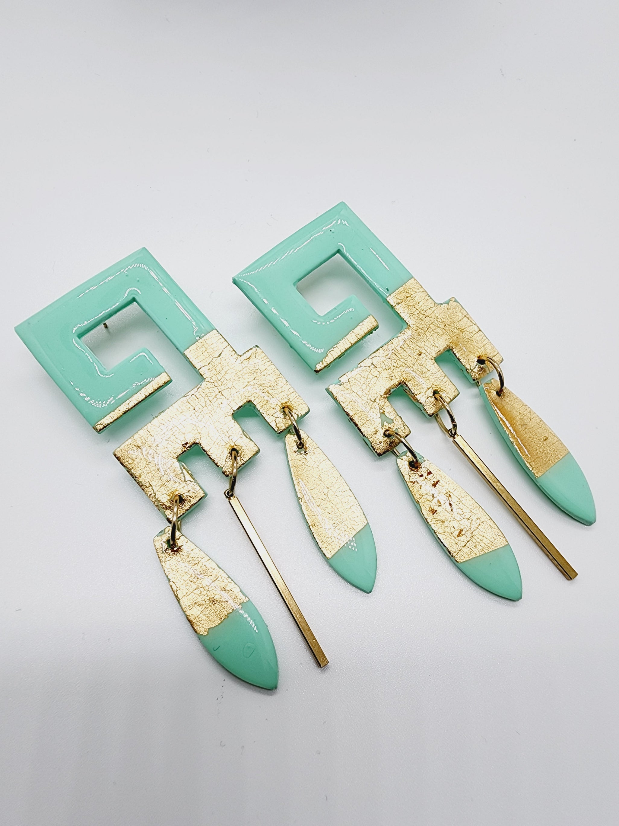 Length: 3.75 inches | Weight: 0.8 ounces   Distinctly You! These handmade earrings are made using seafoam green and gold flake dangle polymer clay, hypoallergic hooks with back closures. 