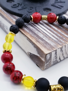 Honor, Courage, and Commitment (US Marine Corps values) inspired bracelet to honor our troops, veterans, and the families that support them! Anchor charm with matte black beads, red and black marble beads, yellow glass beads, matte gold metallic beads, black and white marbled beads, gold faceted spacer bead, and gold spacers. 